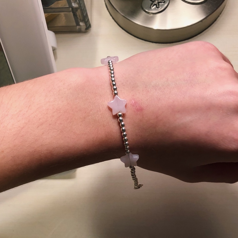 Silver beaded bracelet with light pink star charms